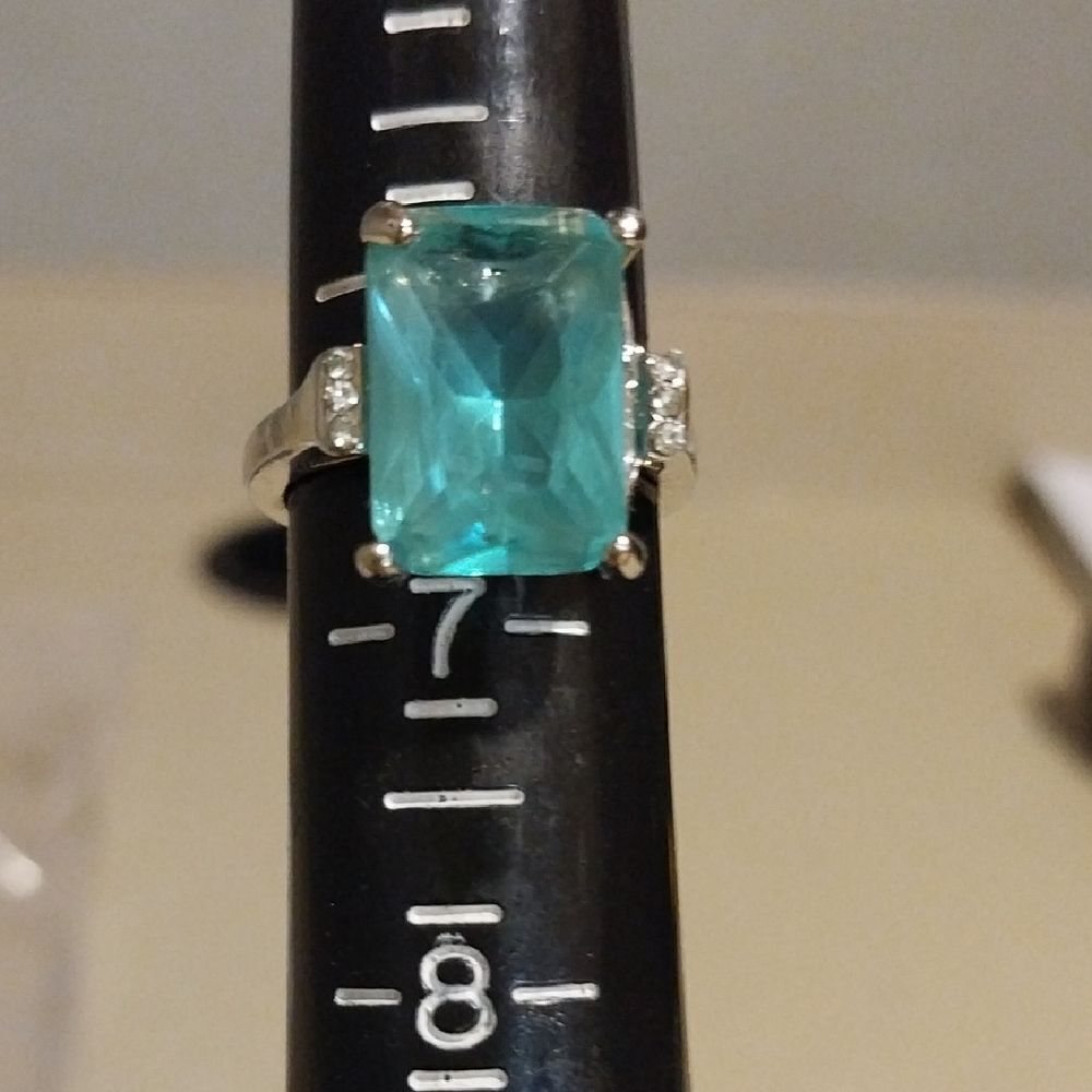 Unlisted Silver Ring with Aqua Gemstone..New Condition...size 6.5